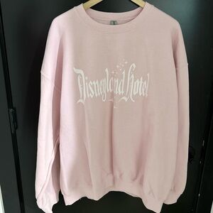 Disney Disneyland Hotel Pink Sweatshirt from Belle & Park